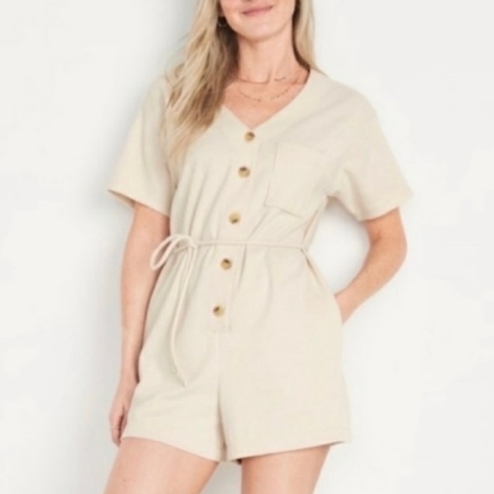 New w/ tag. Romper shorts with pockets.